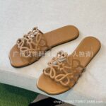 2025 cross-border new casual beach slippers Nigeria Southeast Asia 3D hollow flat bottom one-word strap women's slippers