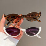 Half-frame cat-eye personalized sunglasses, European and American women's sunglasses, fashion street photography, trendy retro glasses frames, high-end